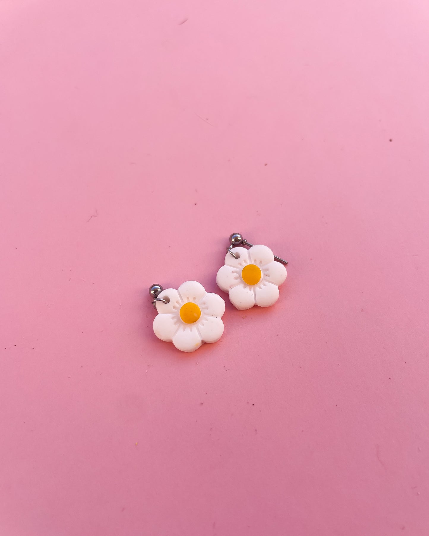 Brincos daisy