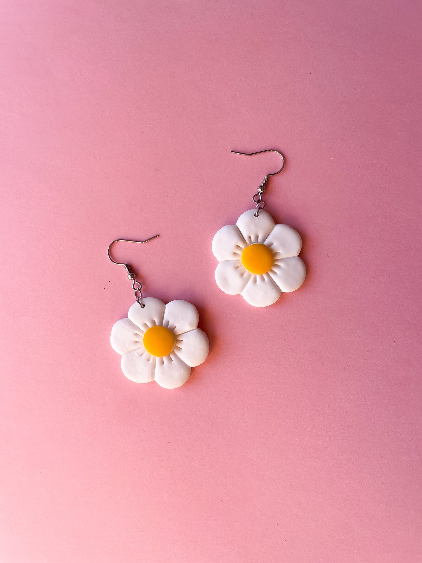Brincos daisy