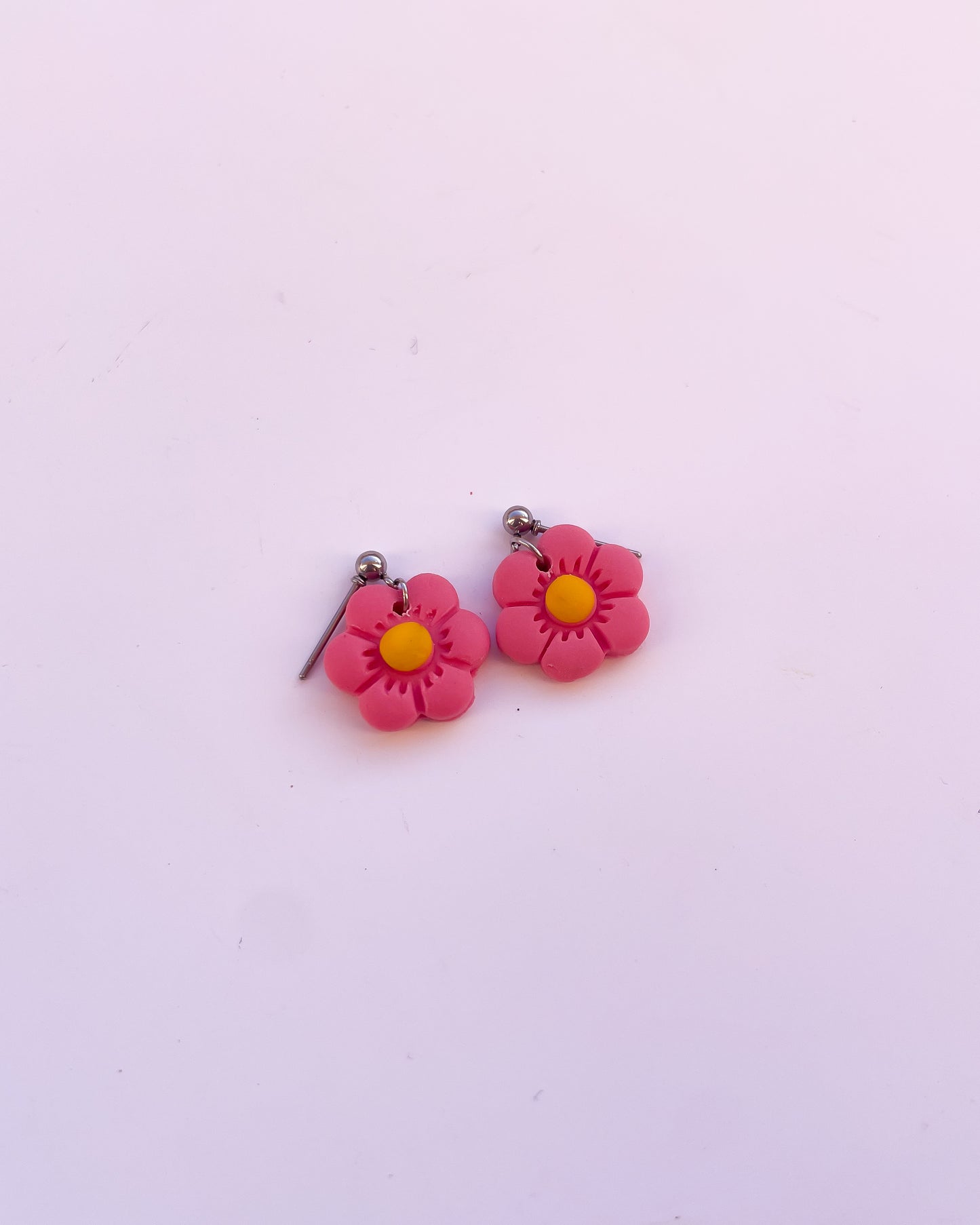 Brincos daisy